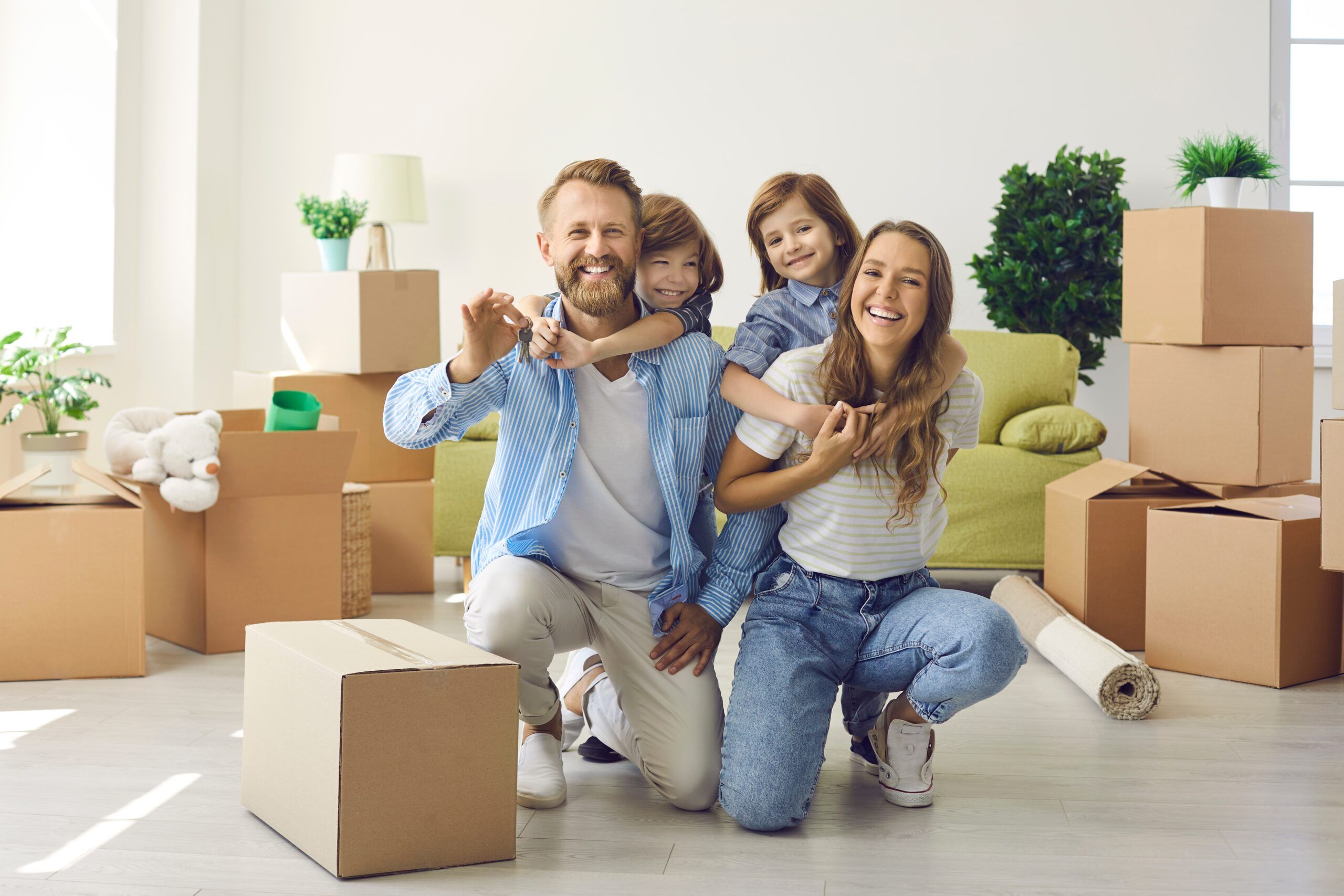 Happy,Family,Showing,Keys,To,New,Home,On,Moving,Day.